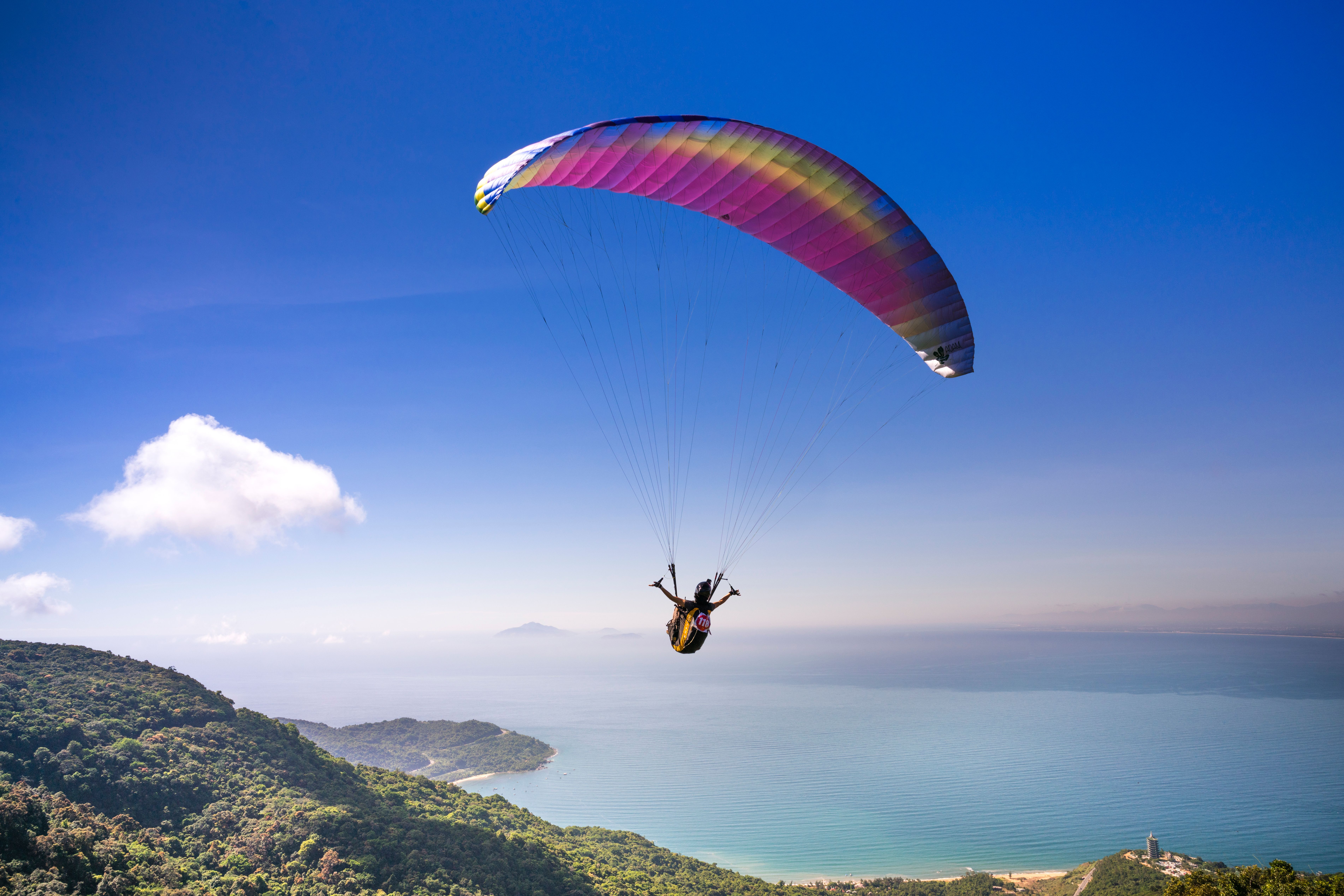 Tandem paragliding over coastal cliffs