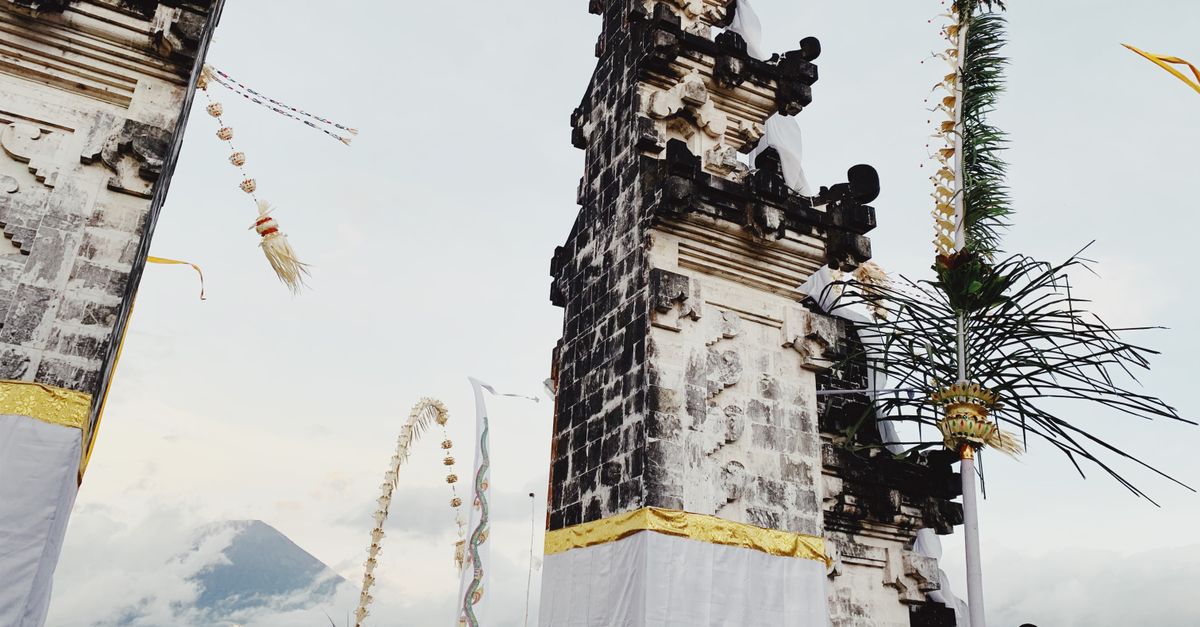 Traditional Balinese temple gates with Mount Agung in the distance