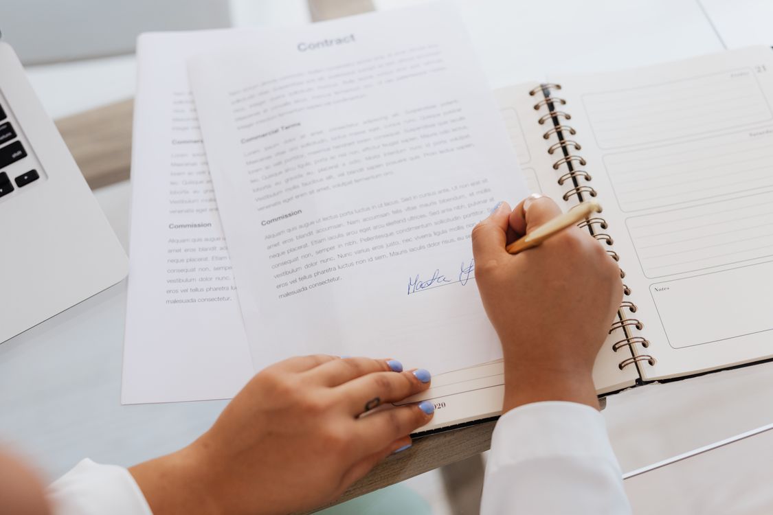 Person reviewing property documents at a desk