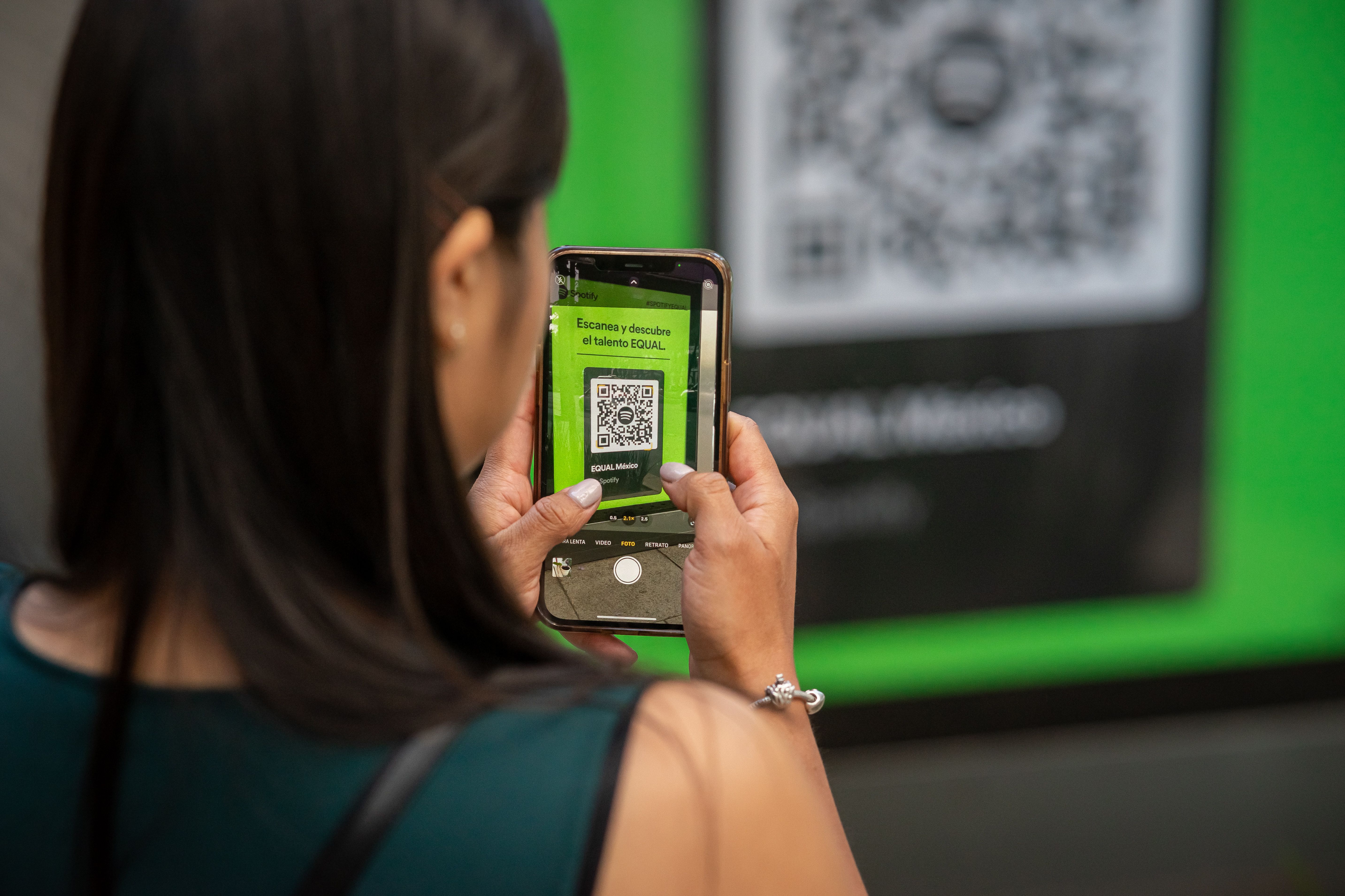 Woman scanning a QR code on her smartphone