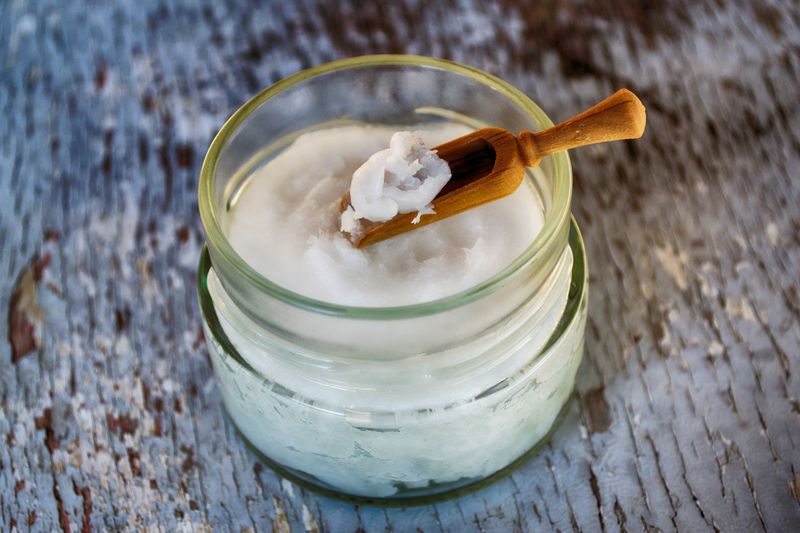 A glass jar of coconut oil, a staple in Balinese skincare routines