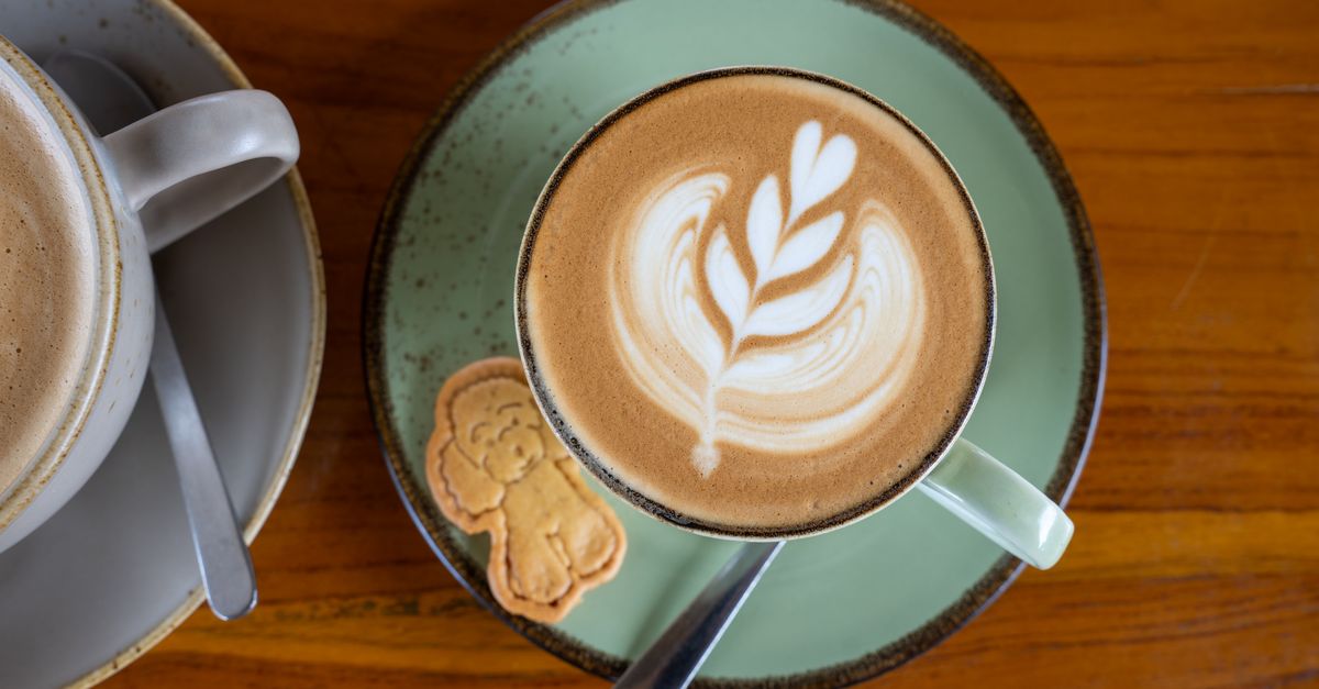 Latte art in a cup of specialty coffee served at a cafe in Bali, Indonesia