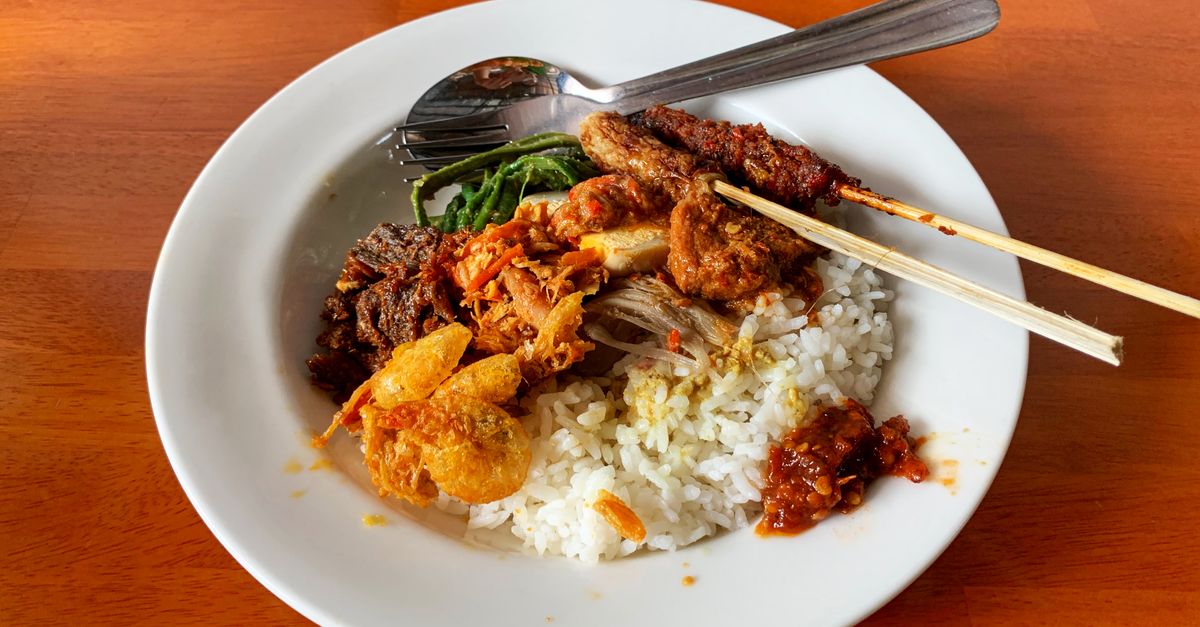 Nasi campur with rice, meat and vegetables served in Bali, Indonesia
