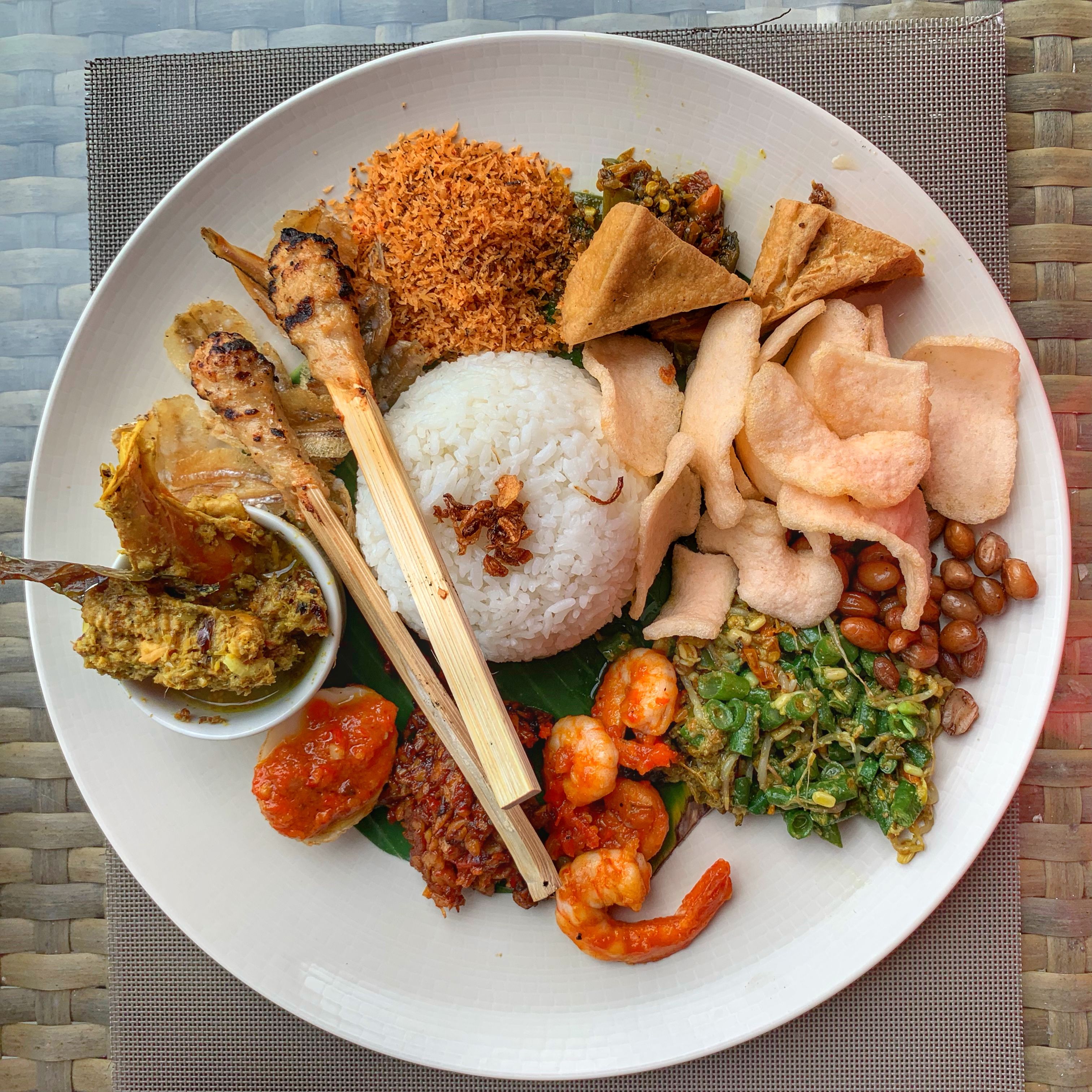 A vibrant plate of traditional Nasi Campur in Bali