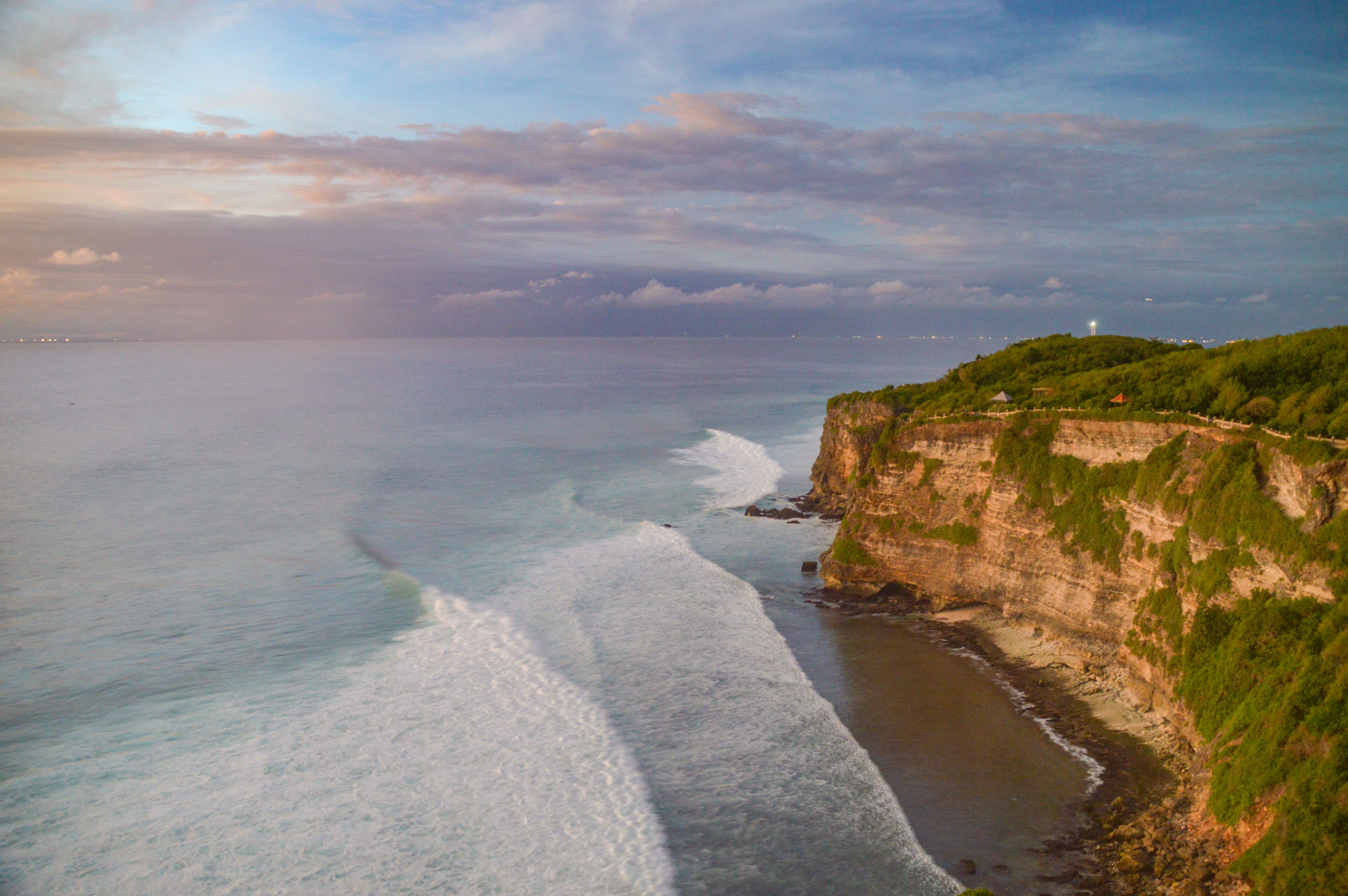 Cliffside sunset view in Uluwatu, Bali — the kind of moment that reminds you why you stayed